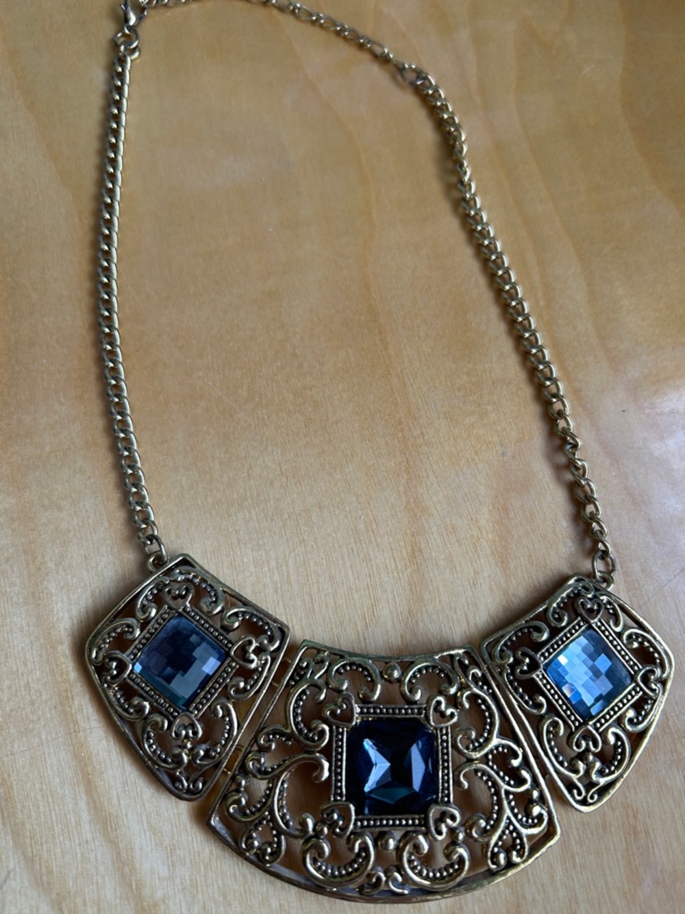 Gold Filigree Necklace with Blue Gemstone Accents